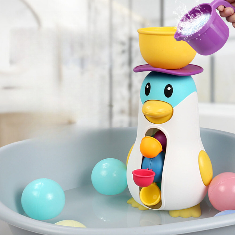 Water-filled wind-up penguin bath toy