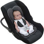 Newborn using the memory foam head and body support insert in a car seat