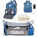 Foldable changing backpack with travel cot