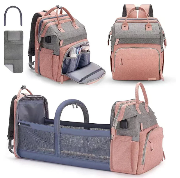 Foldable changing backpack with travel cot