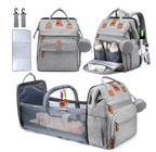 Foldable changing backpack with travel cot