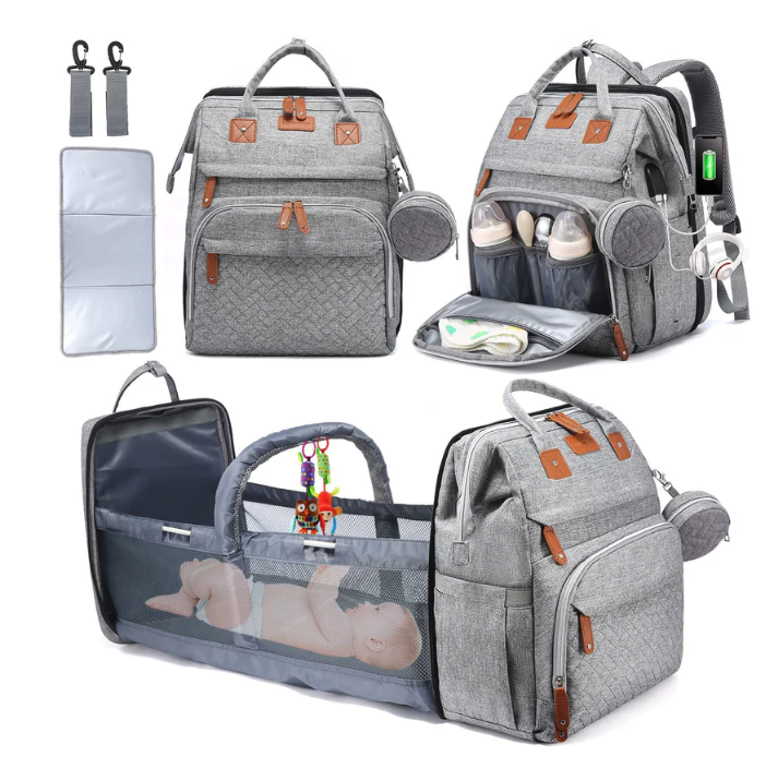 Foldable changing backpack with travel cot