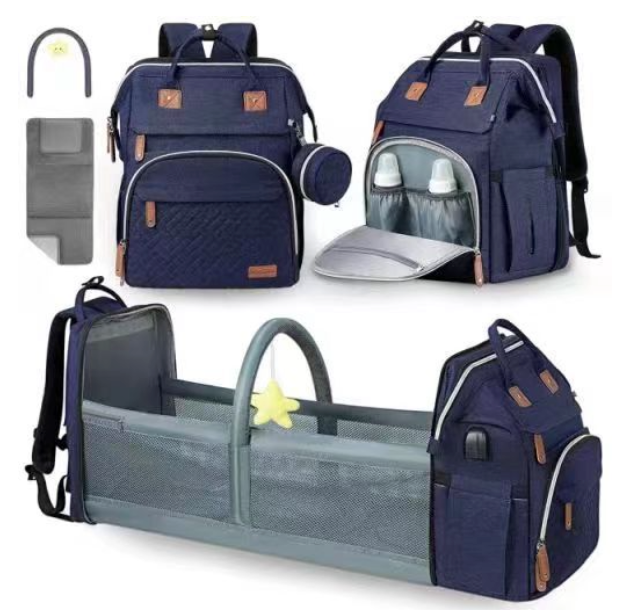 Foldable changing backpack with travel cot