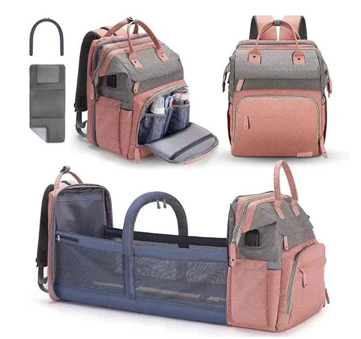 Foldable changing backpack with travel cot