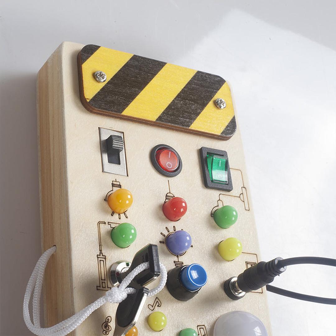 Wooden activity board sensory panel with switches and buttons