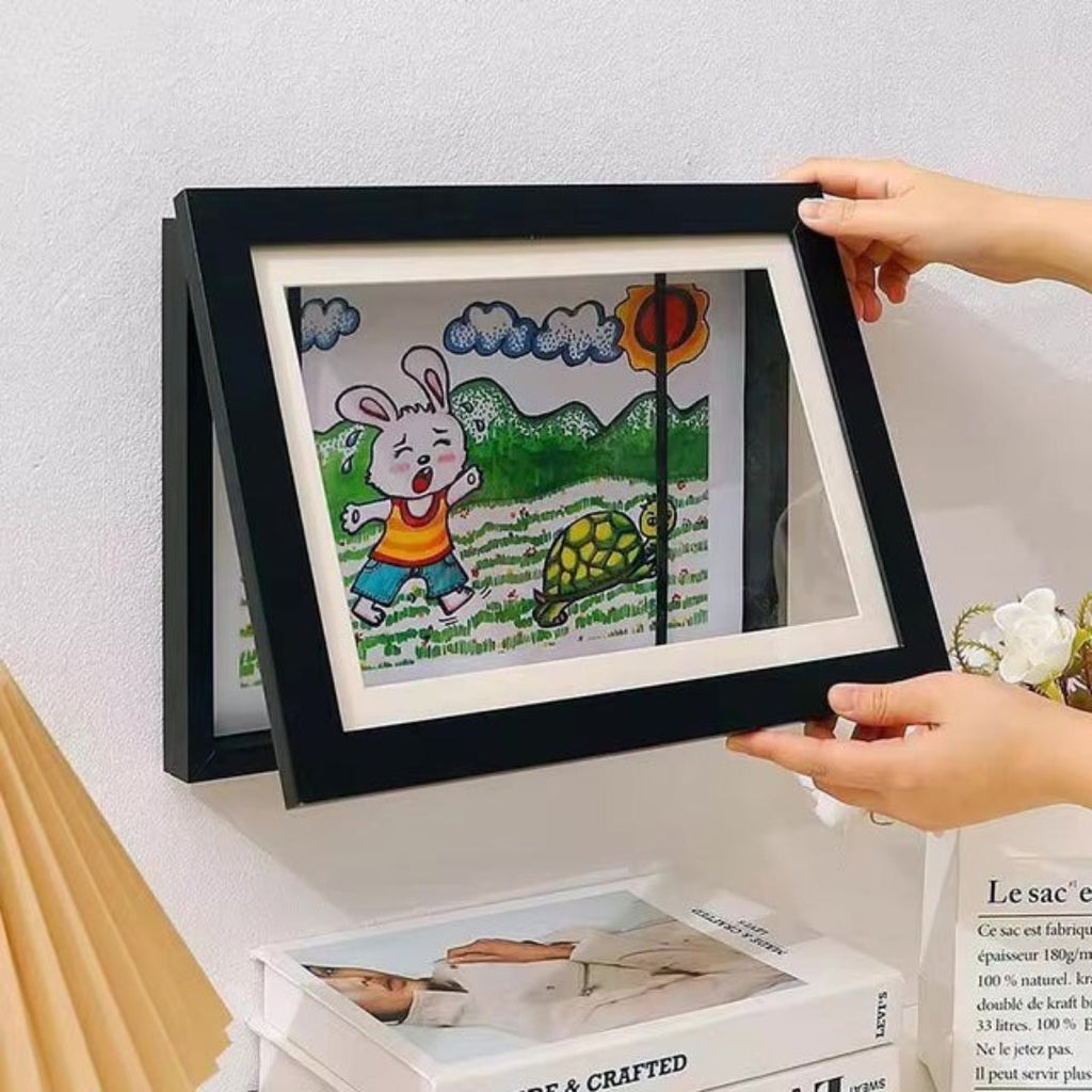 Frame for children's drawings with storage opening