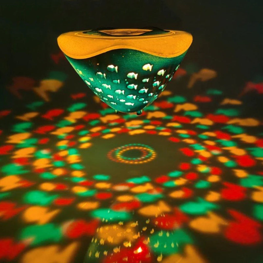 LED bath toy with fountain and spray effect