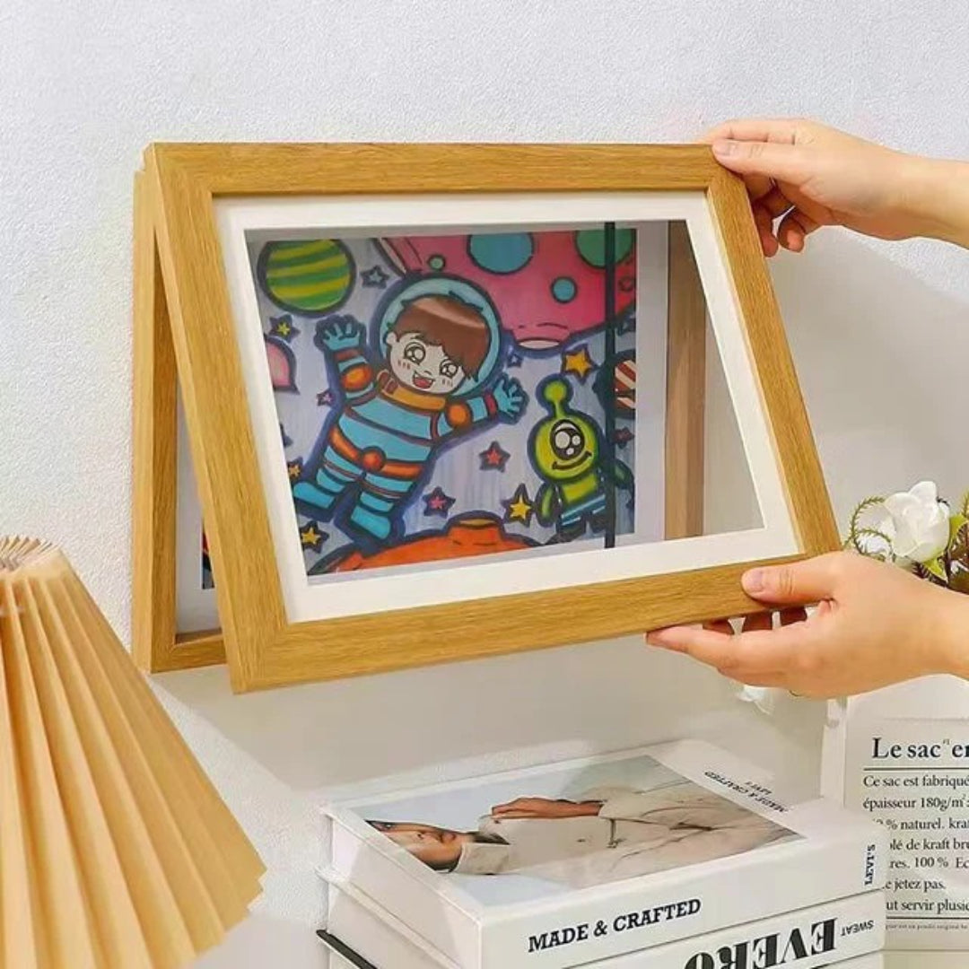 Frame for children's drawings with storage opening