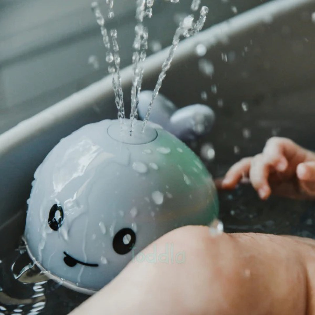 Whale bath toy with spray function