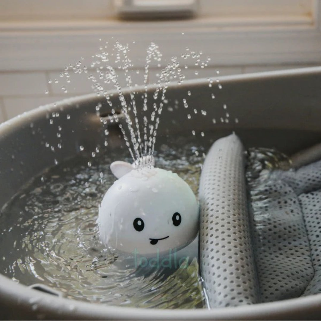 Whale bath toy with spray function